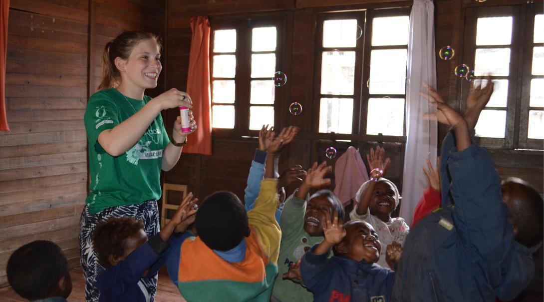 Fundraising is one way of financing your trip to Madagascar. A volunteer is having fun with children in Madagascar after she fundraised her trip to this African country.